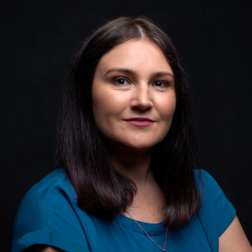 Headshot of Heidi Lee Douglass in a teal t shirt. 