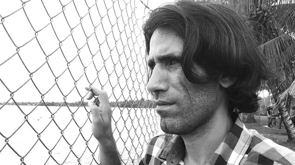 head shot of Behrouz Boochani