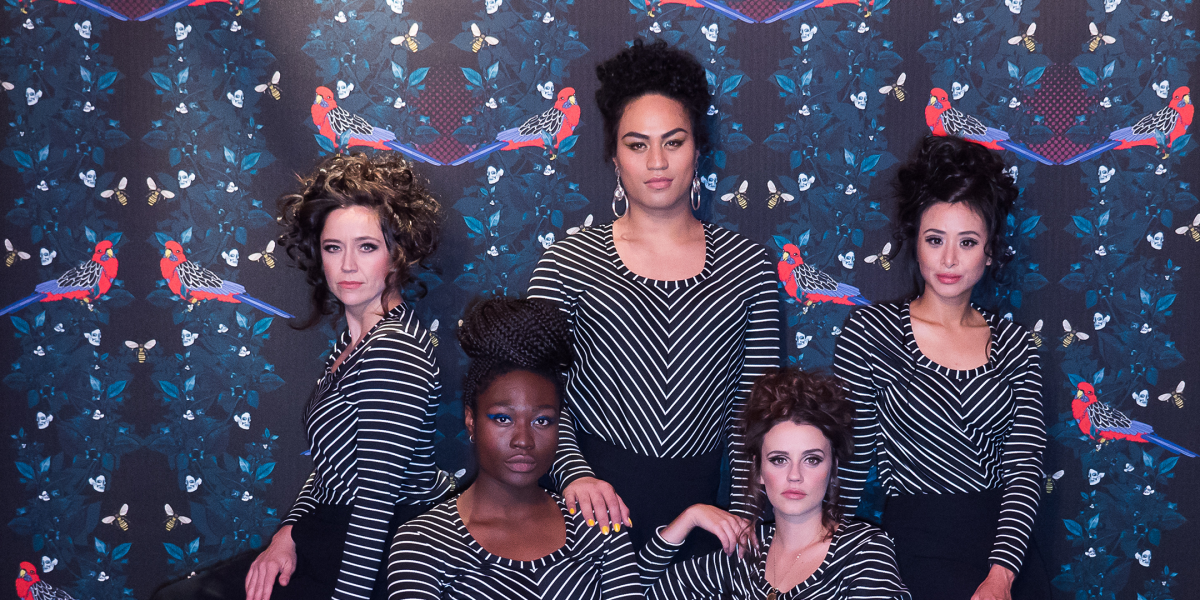 five women looking at camera