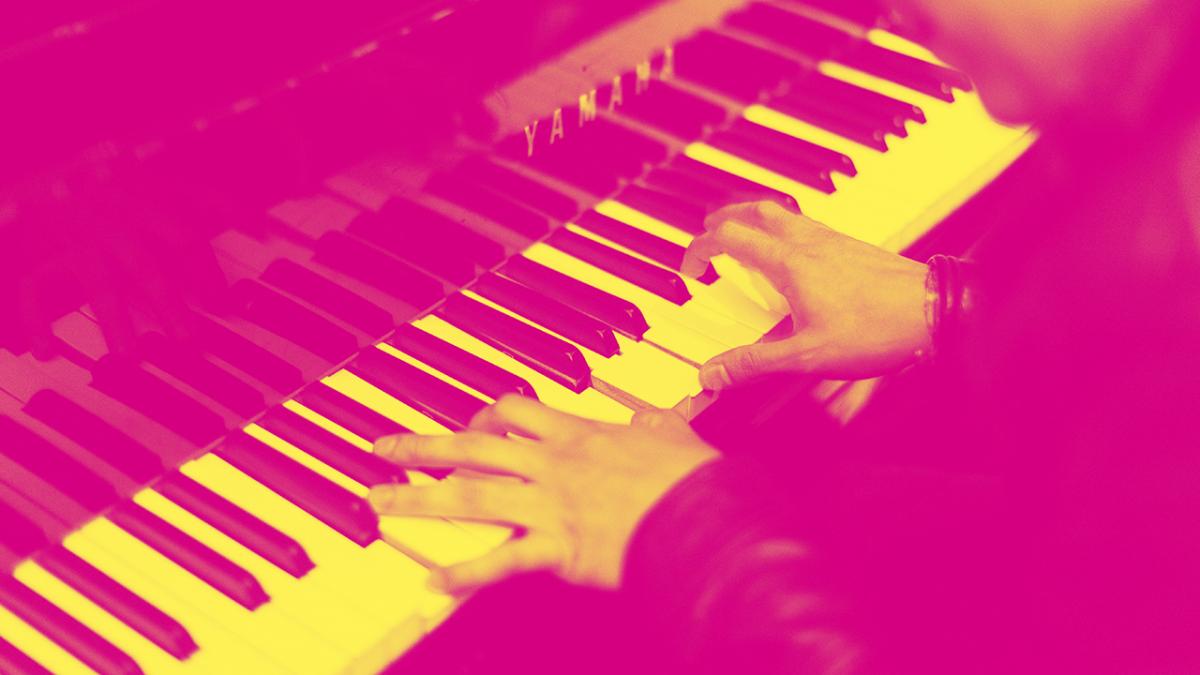 Graphic of hands playing a piano