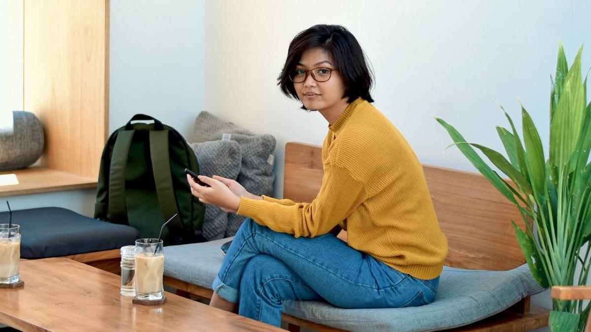 Image of student sitting on couch